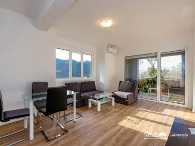 Apartment with sea views in residential building with an elevator in Rafailovici