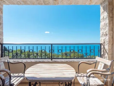 A complex of 6 villas with a swimming pool with an open sea view