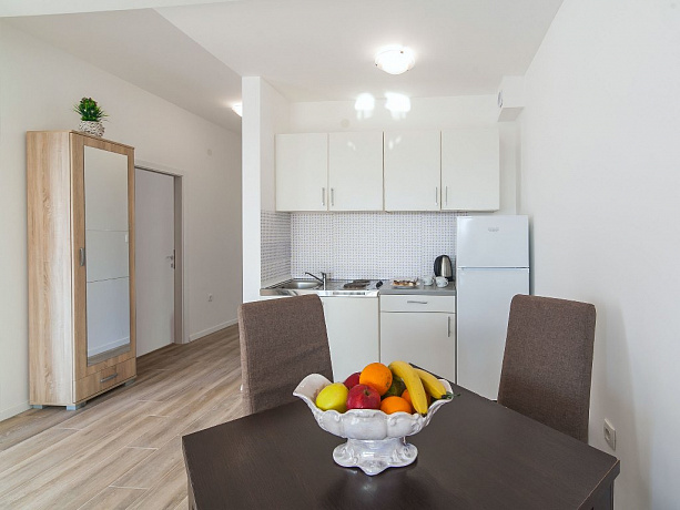 Apartments with sea views in two residential buildings with an elevator in Rafailovici.