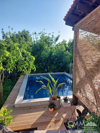 Stone house with pool surrounded by nature in a beautiful rustic village