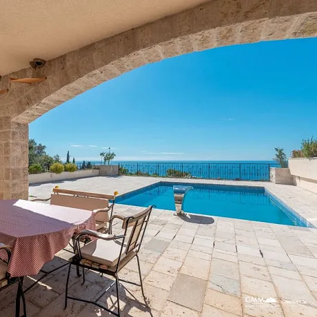 A complex of 6 villas with a swimming pool with an open sea view