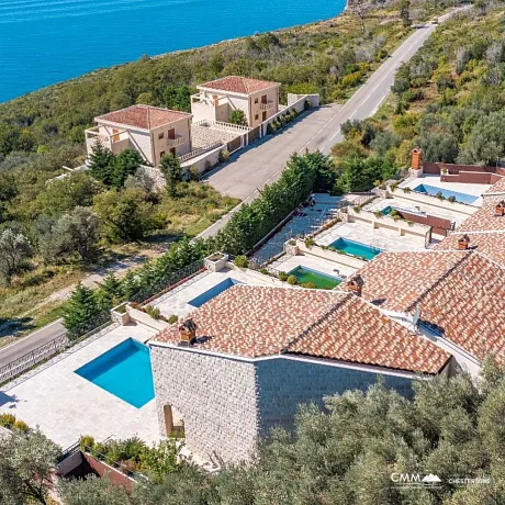 A complex of 6 villas with a swimming pool with an open sea view