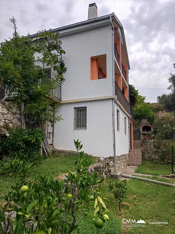 Two-story house with a large plot