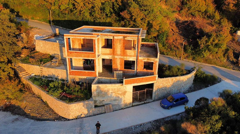 Unfinished house with a pool near Budva in a quiet location