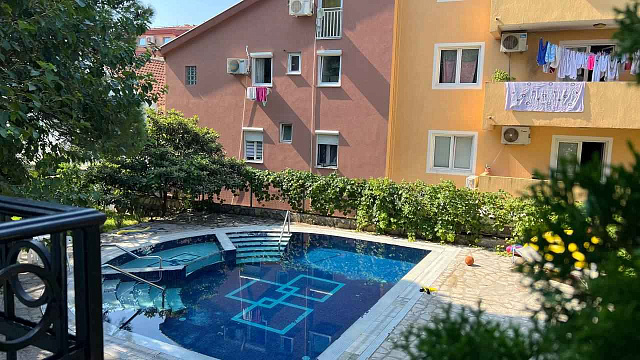Apartment with two bedrooms in a house with a pool in Budva — photo 8